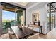 Spacious dining area, wooden table and access to the patio with scenic view at 39115 N 99Th Pl, Scottsdale, AZ 85262