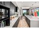 Modern kitchen with white countertops, dark cabinetry and a view at 39115 N 99Th Pl, Scottsdale, AZ 85262