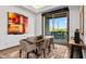 Bright dining area with wooden table, patio view, and natural light at 39115 N 99Th Pl, Scottsdale, AZ 85262