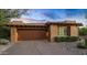 Attached two-car garage with desert landscaping at 39115 N 99Th Pl, Scottsdale, AZ 85262
