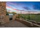 Outdoor grilling station with desert landscape views at 39115 N 99Th Pl, Scottsdale, AZ 85262