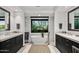 Spa-like bathroom with double vanities, free-standing tub, and stone accents at 39115 N 99Th Pl, Scottsdale, AZ 85262