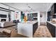 Sleek kitchen features double islands, dark cabinetry, and breakfast bar at 39115 N 99Th Pl, Scottsdale, AZ 85262