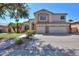 Two-story house with a three-car garage and landscaping at 695 W Estrella Dr, Gilbert, AZ 85233