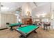 Community game room features two pool tables and comfortable seating at 18112 W Spencer Dr, Surprise, AZ 85374