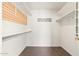 Large walk-in closet with shelving and hanging rods at 18112 W Spencer Dr, Surprise, AZ 85374