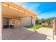 Covered patio with access to backyard and lawn at 18112 W Spencer Dr, Surprise, AZ 85374