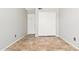 Bedroom with tile flooring, sliding doors and a window at 18112 W Spencer Dr, Surprise, AZ 85374