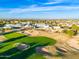 Aerial view of the community clubhouse and golf course at 18112 W Spencer Dr, Surprise, AZ 85374