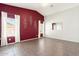 Bright living room with tile flooring and an accent wall at 18112 W Spencer Dr, Surprise, AZ 85374