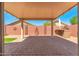 Covered patio with brick pavers and built-in grill at 18112 W Spencer Dr, Surprise, AZ 85374