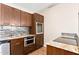 Kitchen with wood cabinets, granite countertops, stainless steel appliances, and tile backsplash at 18112 W Spencer Dr, Surprise, AZ 85374