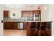 Modern kitchen with wood cabinets, granite countertops, and stainless steel appliances at 18112 W Spencer Dr, Surprise, AZ 85374