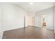 Empty bedroom with tile flooring and access to bathroom at 18112 W Spencer Dr, Surprise, AZ 85374