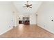 Open living room with tile floors and kitchen views at 18112 W Spencer Dr, Surprise, AZ 85374