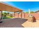 Covered patio, built-in grill, and artificial turf at 18112 W Spencer Dr, Surprise, AZ 85374