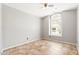 Bedroom with tile flooring and an arched window at 18112 W Spencer Dr, Surprise, AZ 85374