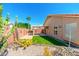 Landscaped backyard with artificial turf and cacti at 18112 W Spencer Dr, Surprise, AZ 85374