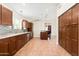Modern kitchen with wood cabinets, granite countertops, and stainless steel appliances at 18112 W Spencer Dr, Surprise, AZ 85374