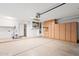Spacious garage with built-in cabinets and workspace at 18112 W Spencer Dr, Surprise, AZ 85374