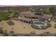 Aerial view of a luxurious house with a pool, expansive backyard, and desert landscape at 29537 N 155Th Ave, Surprise, AZ 85387