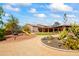 Landscaped backyard with playground and desert plants at 29537 N 155Th Ave, Surprise, AZ 85387