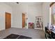 Bright bedroom with an ensuite bathroom and toy storage at 29537 N 155Th Ave, Surprise, AZ 85387