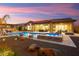 Stunning pool and spa area with a spacious patio and outdoor kitchen at 20554 W Pasadena Ave, Buckeye, AZ 85396