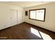 Bright bedroom with hardwood floors and sliding door closet at 6439 E Camino Santo Dr, Scottsdale, AZ 85254