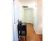 Bright hallway with wood-look floors and a small storage cabinet at 475 Leisure World --, Mesa, AZ 85206