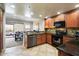Open kitchen features granite counters, stainless steel appliances, and views into dining area at 21320 N 56Th St # 2145, Phoenix, AZ 85054