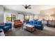 Spacious living room with comfortable seating and fireplace at 21320 N 56Th St # 2145, Phoenix, AZ 85054