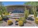 Community fountain with a stone wall and desert landscaping at 21320 N 56Th St # 2145, Phoenix, AZ 85054