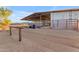 Exterior view of covered stables with riding arena at 29315 N 140Th St, Scottsdale, AZ 85262