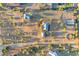 Aerial view of a large property with a house, stables, and riding arena at 29315 N 140Th St, Scottsdale, AZ 85262