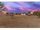 Ranch style home exterior at sunset with attached garage at 29315 N 140Th St, Scottsdale, AZ 85262