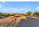 Large riding arena with sand surface and surrounding fencing at 29315 N 140Th St, Scottsdale, AZ 85262