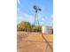 Tall windmill and water tank in a desert landscape at 29315 N 140Th St, Scottsdale, AZ 85262