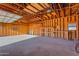 Spacious garage interior with high ceilings and built-in shelving at 29315 N 140Th St, Scottsdale, AZ 85262