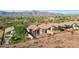 Aerial view showcasing multiple homes with desert landscape and mountain backdrop at 10109 E Trailhead Ct, Gold Canyon, AZ 85118