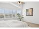 Main bedroom with plantation shutters, a ceiling fan, and a tranquil atmosphere at 10109 E Trailhead Ct, Gold Canyon, AZ 85118