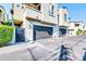 Attached garage with modern dark gray doors and gated entry at 4216 N 27Th St # 106, Phoenix, AZ 85016