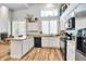 Spacious kitchen featuring an island and updated cabinetry at 4216 N 27Th St # 106, Phoenix, AZ 85016
