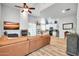 Open concept living room with L-shaped couch and kitchen island at 4216 N 27Th St # 106, Phoenix, AZ 85016