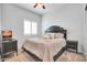 Bright bedroom with a queen-size bed and window shutters at 4216 N 27Th St # 106, Phoenix, AZ 85016