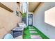 Private patio with artificial turf, fire pit, and seating area at 4216 N 27Th St # 106, Phoenix, AZ 85016