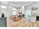 Open concept living room with L-shaped couch and fireplace at 4216 N 27Th St # 106, Phoenix, AZ 85016
