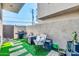 Outdoor patio with artificial grass, seating, and grill at 4216 N 27Th St # 106, Phoenix, AZ 85016