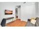 Home office with wood flooring, built-in shelving, and comfortable seating at 4216 N 27Th St # 106, Phoenix, AZ 85016
