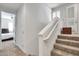 Upstairs hallway with carpeted stairs and access to bedrooms at 4216 N 27Th St # 106, Phoenix, AZ 85016